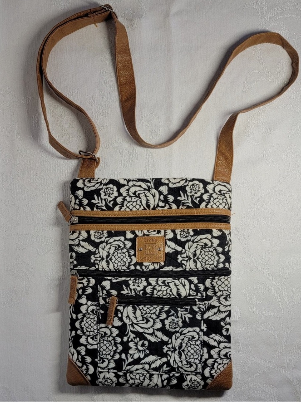 Stone Mountain Accessories Black & Cream Floral Crossbody with Tan Trim